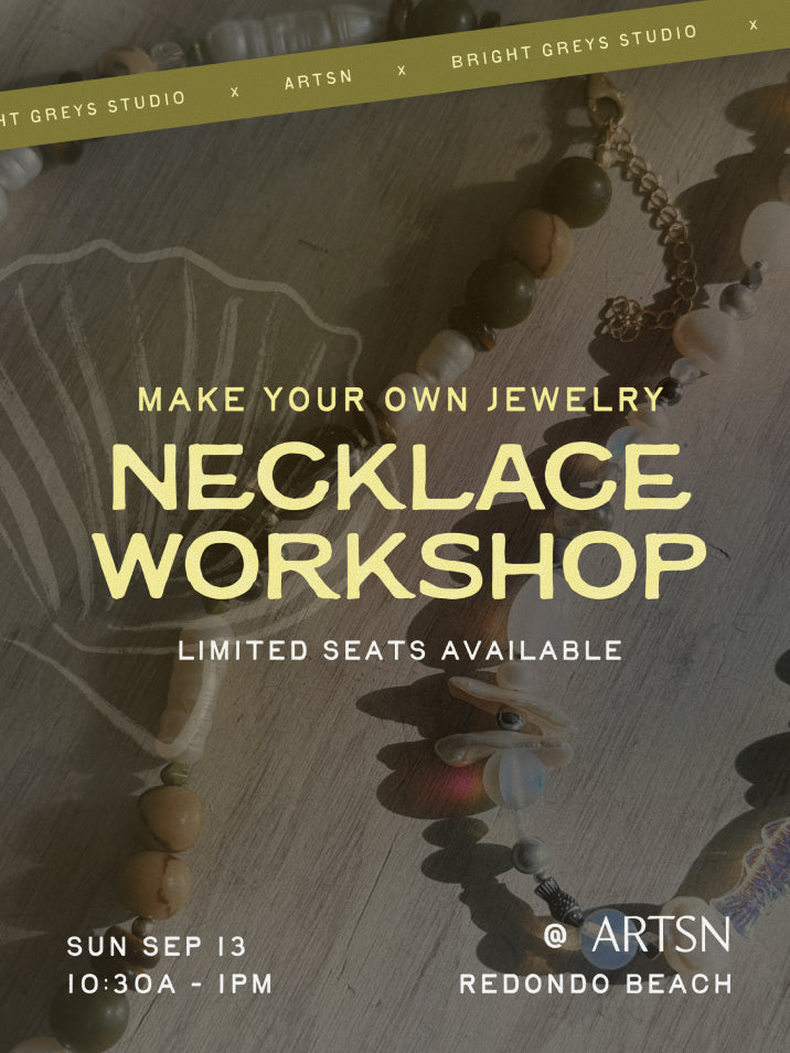 Promotional graphic for a jewelry necklace workshop, featuring large text reading 'MAKE YOUR OWN NECKLACE WORKSHOP' over a styled flat-lay of wooden beads, shells, and a necklace on a tabletop. Smaller text includes 'LIMITED SEATS AVAILABLE,' date and time 'SUN SEP 13 10:30A - IPM,' and 'ARTSN REDONDO BEACH.